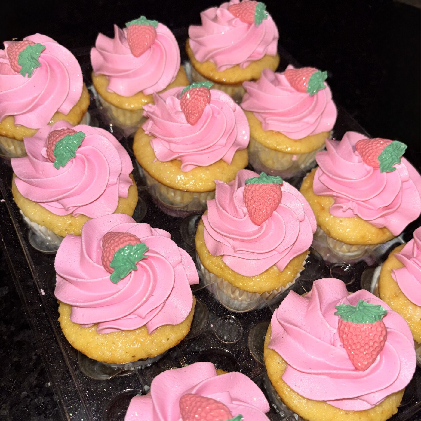 Custom-ordered vegan cupcakes with strawberry frosting!